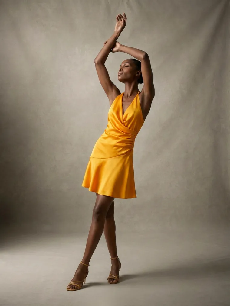 Arms overhead, sculptural silhouette